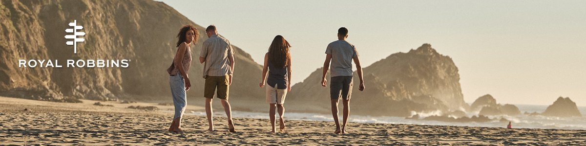 4 adults on a beach walking with a Royal Robins logo