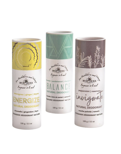 Three tubes of natural deodorant side by side, energize with yellow top, balance with turquoise top, and invigorate with purple top