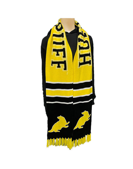 Product Image – Black and yellow Hufflepuff team scarf with yellow tassels and badger symbol; hanging on manequin