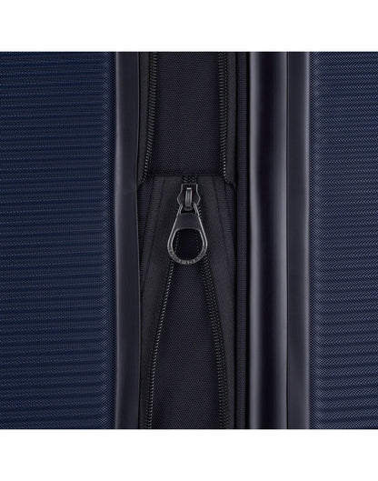 Close up of expandable zipper on navy Bugatti Wellington Hardside 28" Expandable Spinner