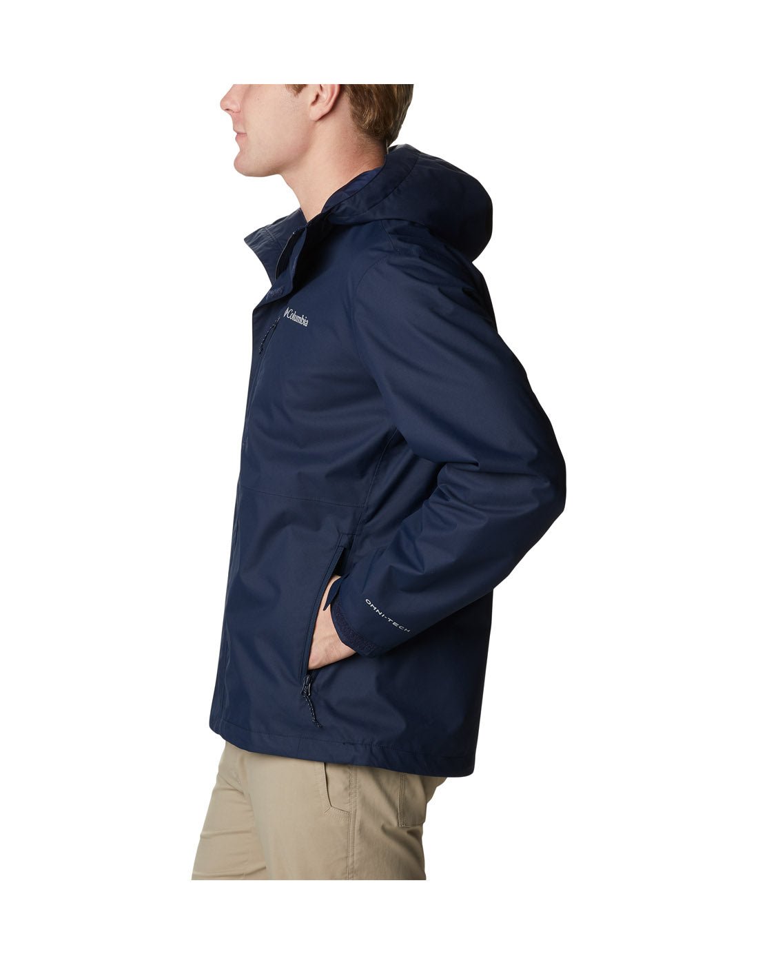 Left side view of a man wearing Columbia Men's Hikebound™ Rain Jacket in Collegiate Navy with hand in side pocket.