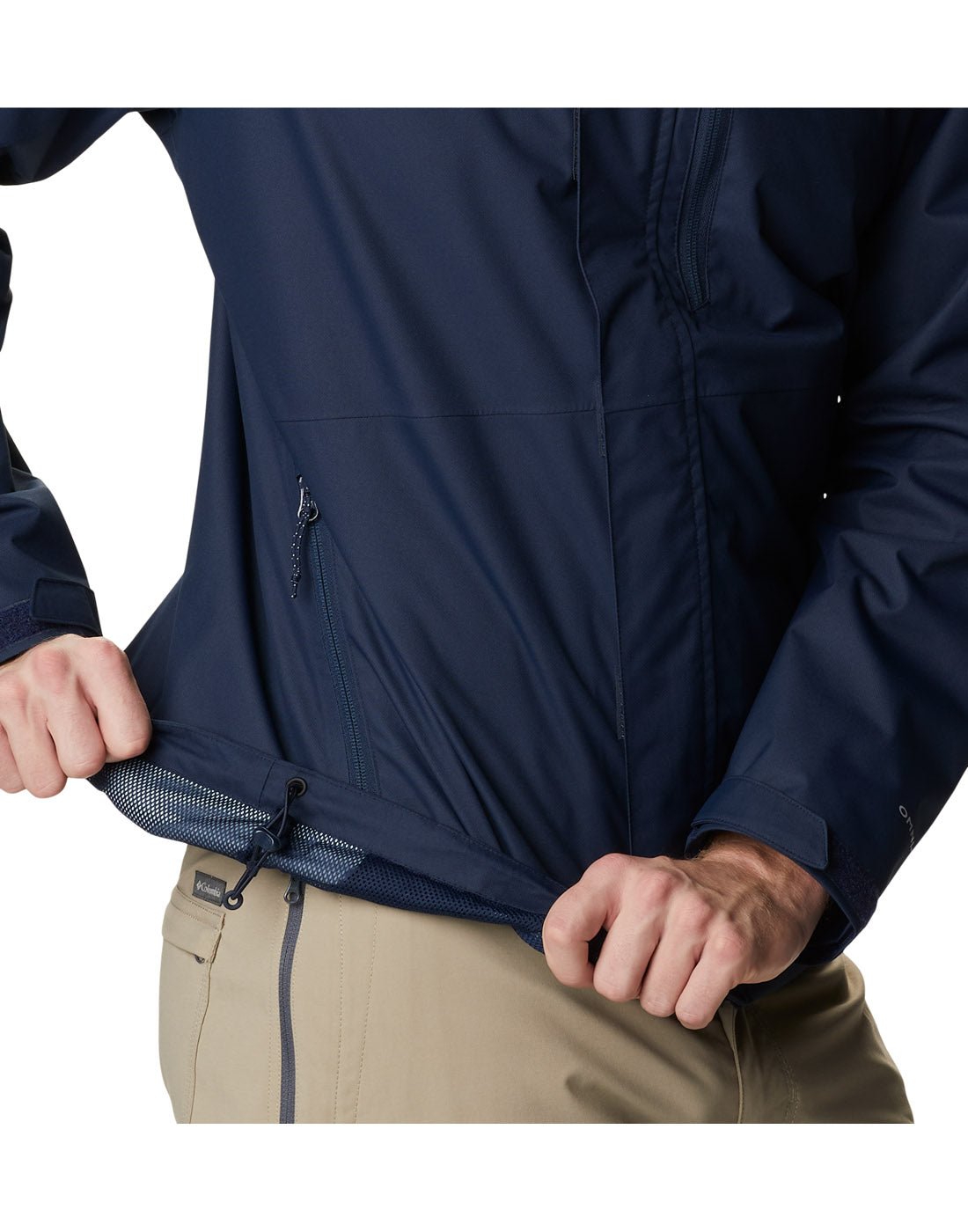 Right side close up view of a man wearing Columbia Men's Hikebound™ Rain Jacket in collegiate navy, hem rolled up to show adjustable drawcord.