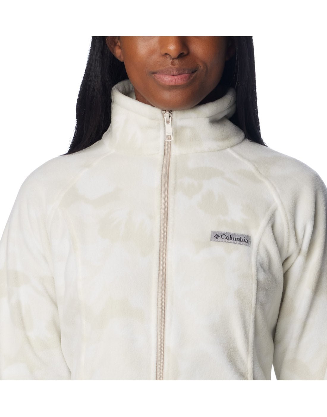 Close up of woman wearing Columbia Women's Benton Springs™ Printed Full Zip Fleece Jacket in dark stone peonies pattern, front view, zipped up with Columbia logo on left chest