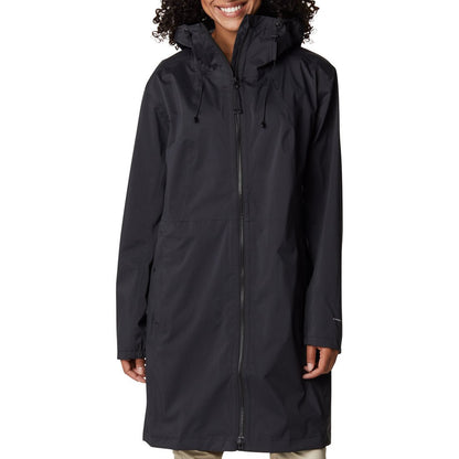 Woman wearing Columbia Women's Weekend Adventure™ Long Shell Jacket in black, zipped up, front view, jacket reaches knee length