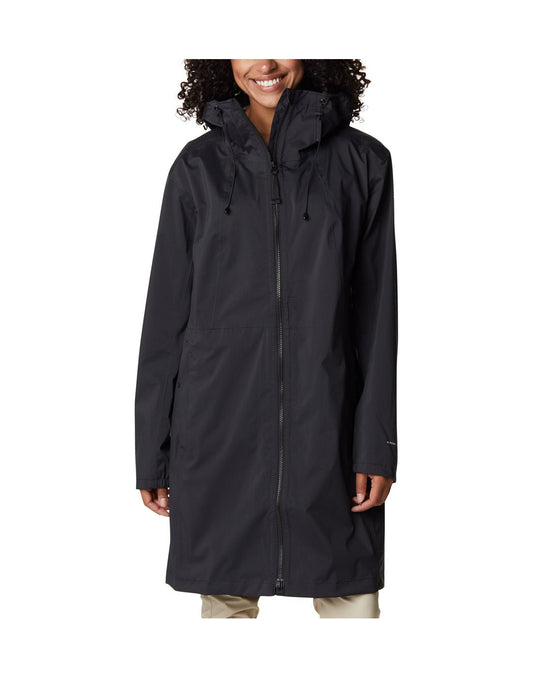 Product Image – Woman wearing Columbia Women's Weekend Adventure™ Long Shell Jacket in black, zipped up, front view, jacket reaches knee length