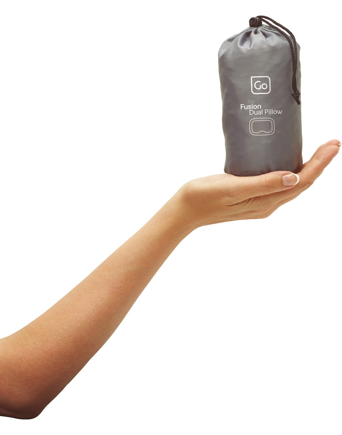 Close up view of hand holding Go Travel The Fusion Dual Pillow in  carry pouch.