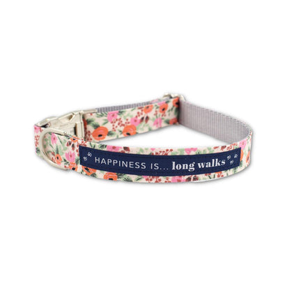 Happiness Is... Long Walks Floral Dog Collar with silver clip and navy blue strip with white small paw prints and words that say Happiness Is...long walks