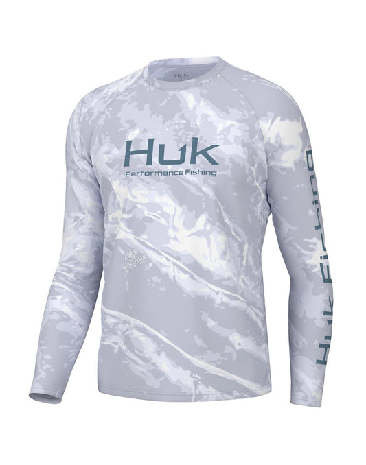 Product Image – Front view of the Huk Men's Mossy Oak Pursuit Performance Shirt in Mossy Oak Stormwater Bonefish colour.  Huk logo printed across chest and "Huk Fishing" along  outside length of left sleeve.