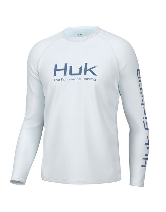 Product Image – Front view of the Huk Men's Pursuit Performance Shirt  in white. Huk logo printed across chest and "Huk Fishing" along outside length of left sleeve.