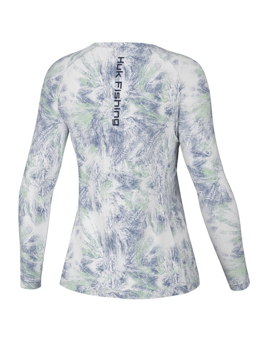 Product Image – Back view of the Huk Women's Pursuit Performance Shirt in Aqua Dye White colour with "Huk Fishing" printed vertically in centre of shirt between shoulder blades.