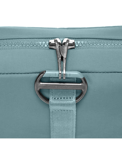 Close up of locking zipper pulls on fresh mint Pacsafe® CX Anti-theft Square Crossbody