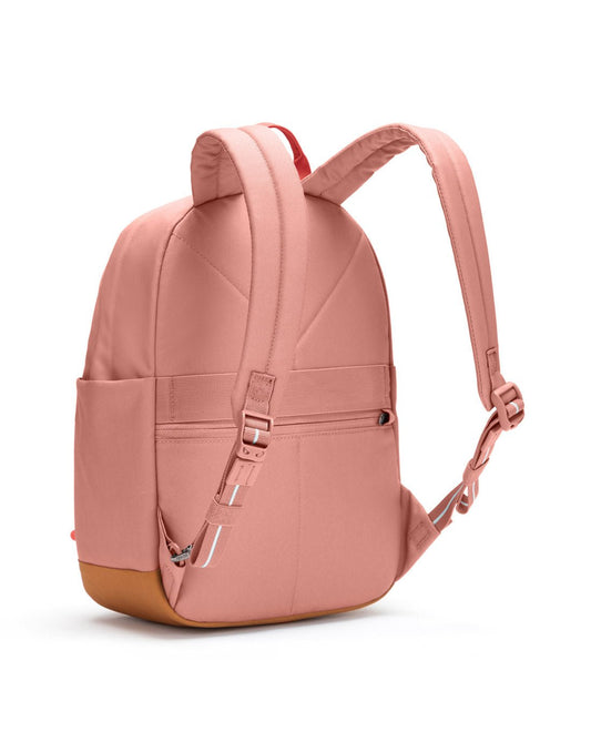 Product Image – Pacsafe® Go 15L Anti-theft Backpack, rose colour with tan bottom gusset, back left angled view.