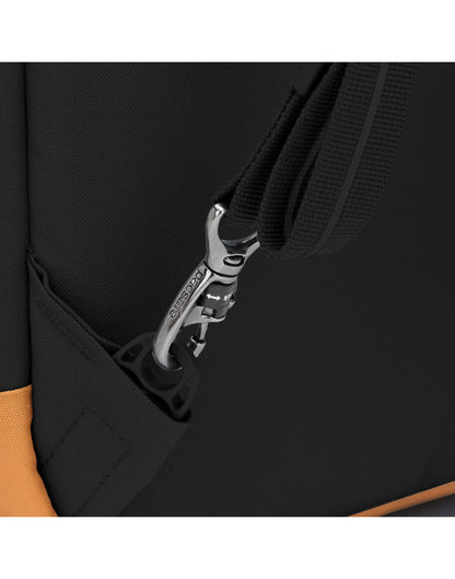 Close up of TurnNLock strap clip on black backpack