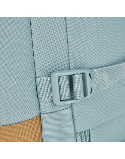 A close-up of an external compression strap that secures and stabilizes contents for ease of carrying.