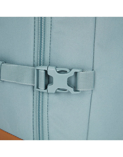 Close-up of an external compression strap that secures and stabilizes backpack contents.