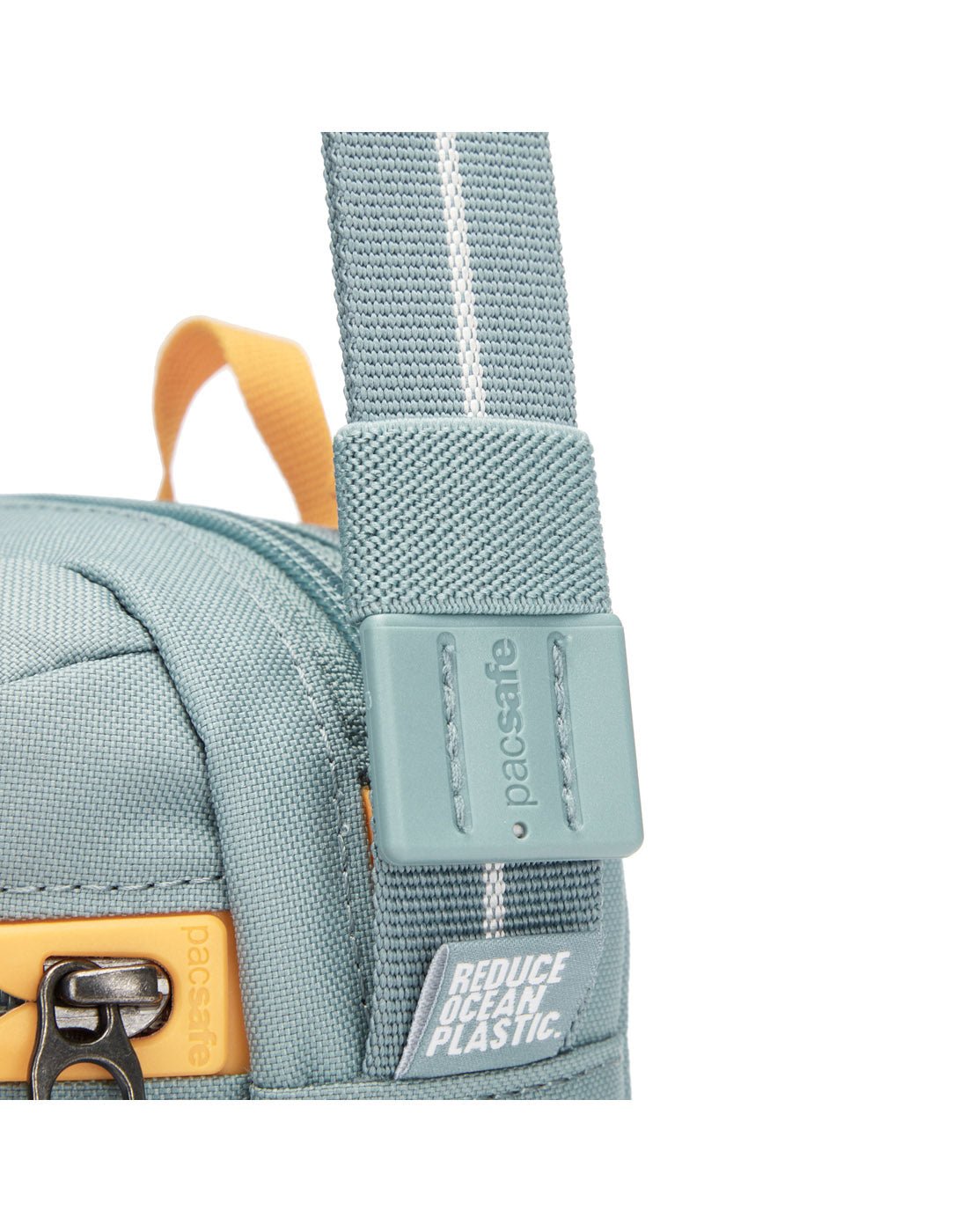 Pacsafe® GO Anti-Theft Festival Crossbody in fresh mint colour close-up of cut resistant shoulder strap.