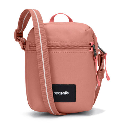 Pacsafe® GO Anti-Theft Micro Crossbody in rose colour, front view.