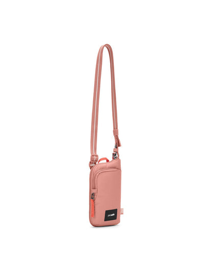 Pacsafe® GO Anti-Theft Tech Crossbody in rose colour front left side view with Carrysafe® slashguard strap extended.