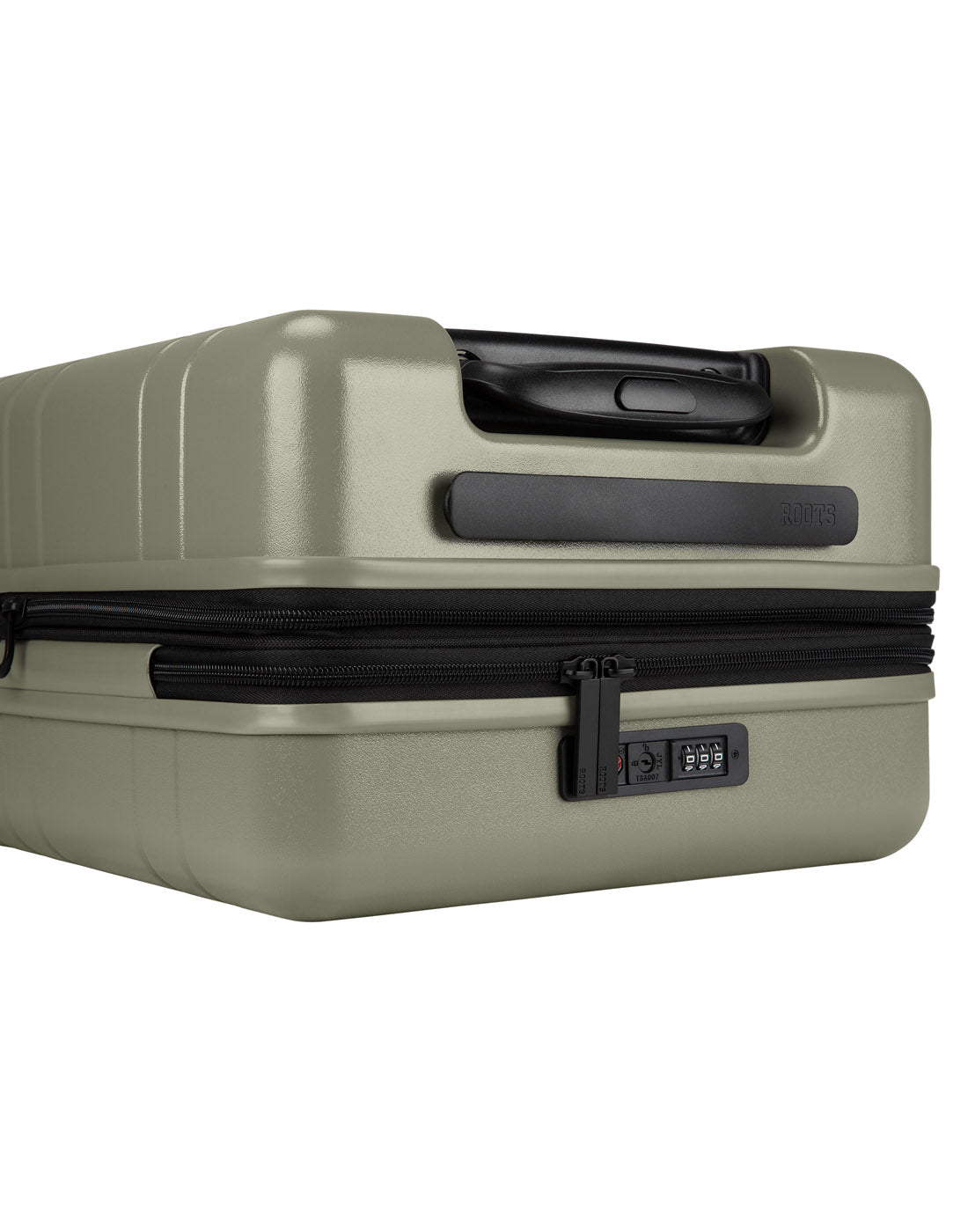 Roots Travel 19" Hardside Spinner Carry-on in sage, close-up view of integrated TSA lock and self repairing zippers.