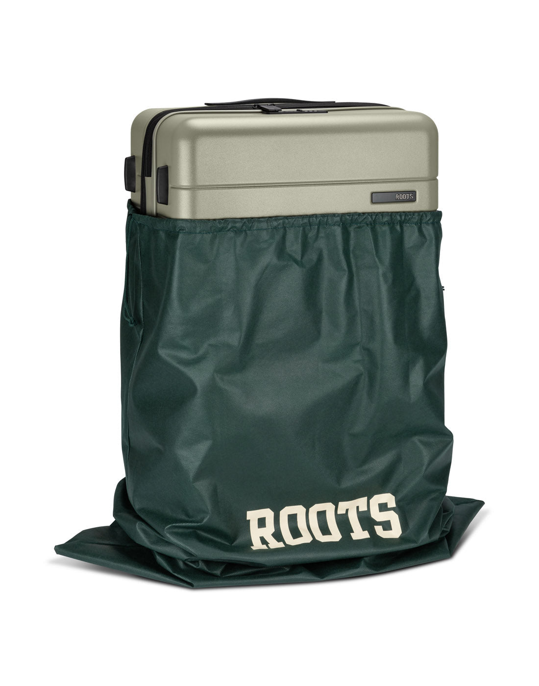 Front angle view of Roots Travel 24" Expandable Hardside Spinner in sage, placed inside a Roots bag.