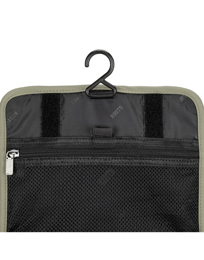 Roots Travel Toiletry Bag in sage, close-up view of mesh pocket and hook.