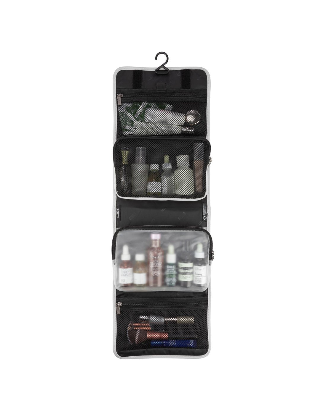 Front view of Roots Travel Toiletry Bag in antarctica, unfolded with items placed inside interior pockets.