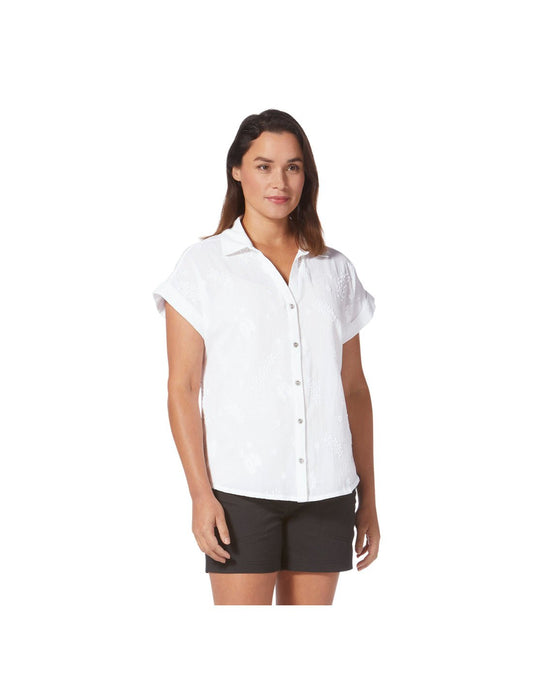 Product Image – Woman wearing black shorts and Royal Robbins Women's Oasis Short Sleeve in white, front view