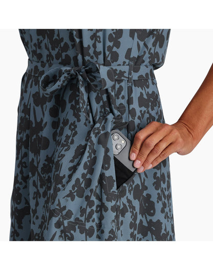 Close up of hand putting a phone into pocket of the Spotless Traveller Tank Dress in Sea Alamere Print