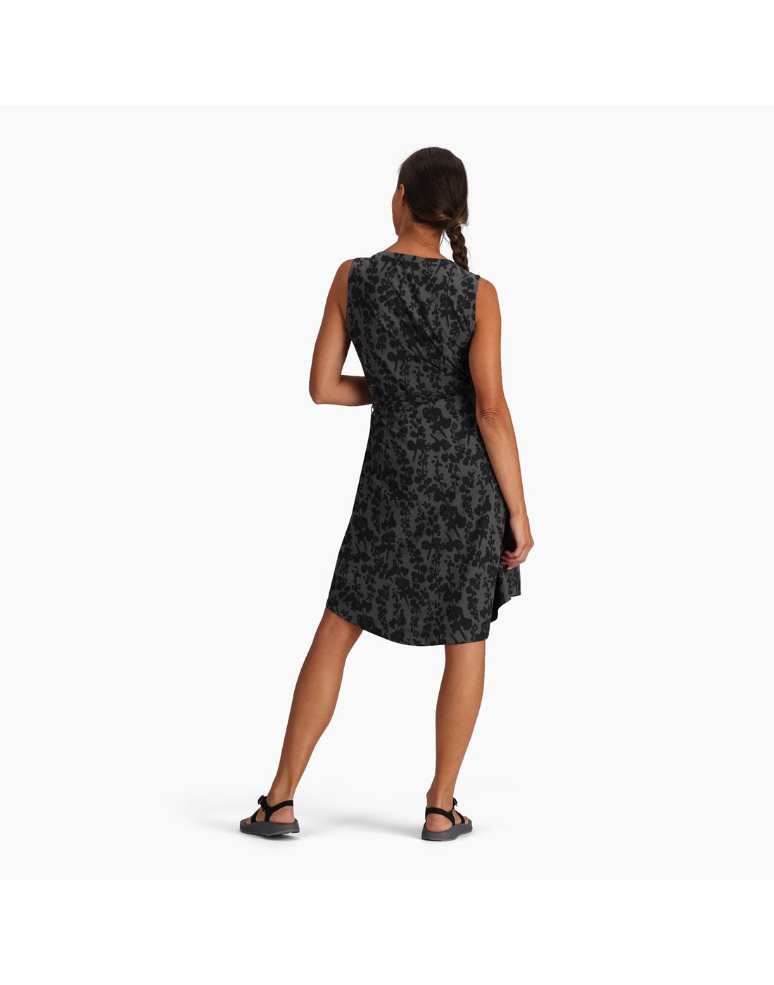 Woman wearing Royal Robbins Women's Spotless Traveller Tank Dress in asphalt alamere print, black on black floral, back view