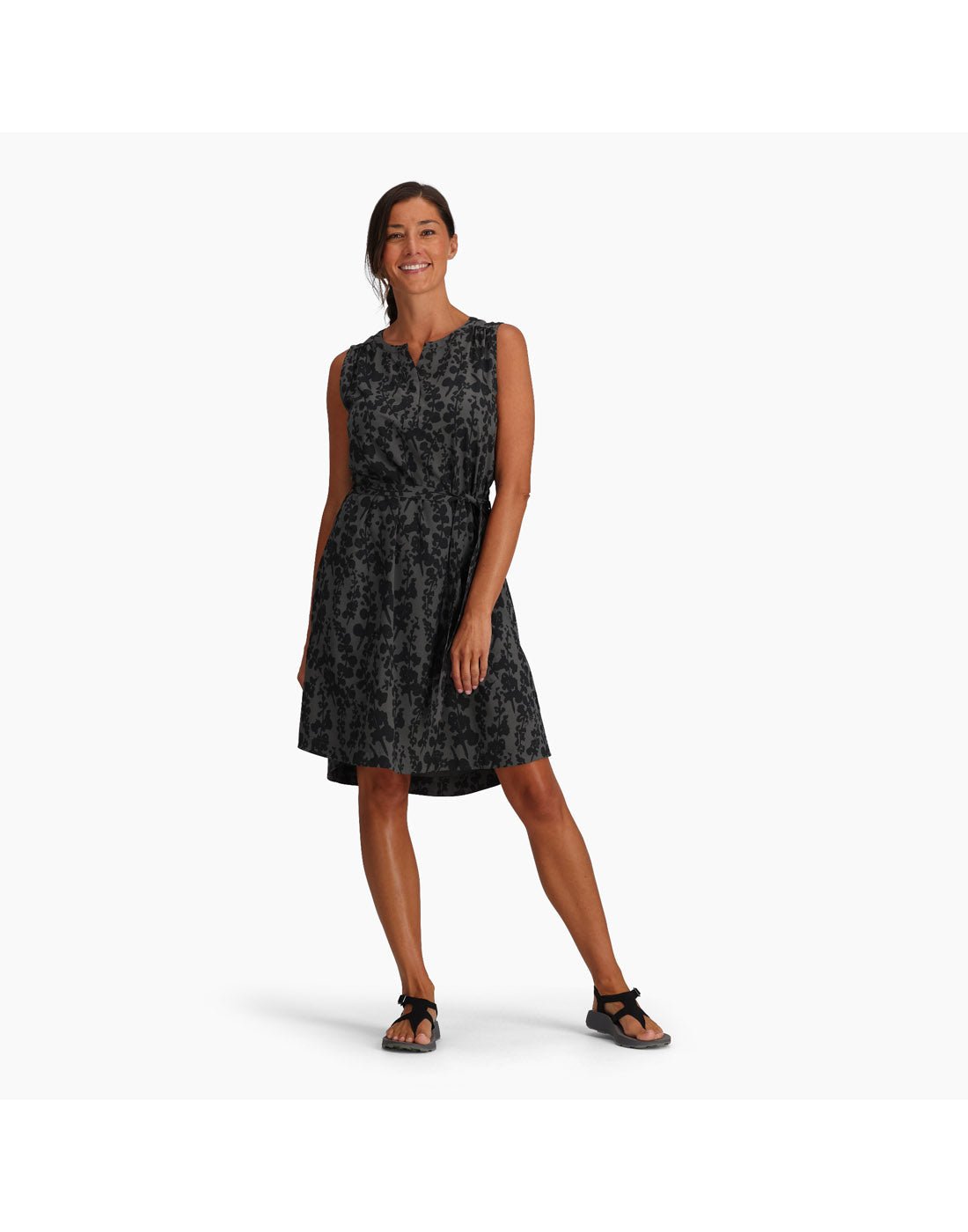 Woman wearing Royal Robbins Women's Spotless Traveller Tank Dress in asphalt alamere print, black on black floral, front view