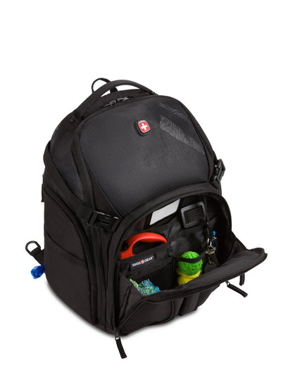 Swiss Gear Premium Pet Backpack, black, front angled view with front zippered pocket open with accessories and toys inside