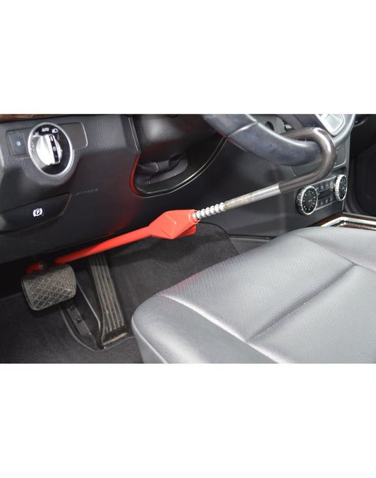 Product Image – Lifestyle image of The Club® Pedal to Wheel Lock in use, one end hooked on steering wheel and other end hooked to brake pedal