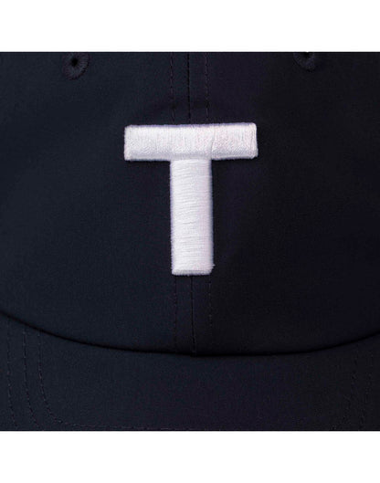 Close up of large white stitched T on dark navy Tilley T Golf Cap