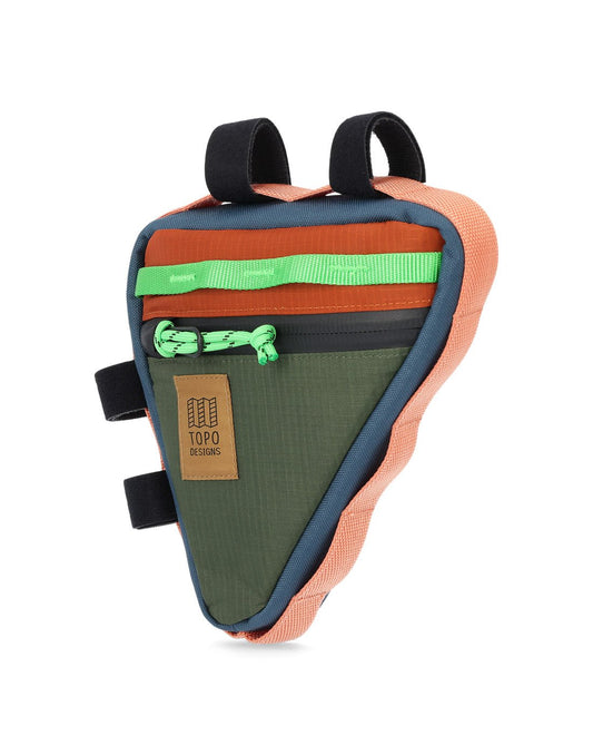 Product Image – Front angled view of Topo Designs Bike Frame Bag in olive and clay with light green daisy chain strip along top of triangular shaped bag, light green zipper pull, khaki rectangular logo patch, light pink daisy chain webbing surrounding entire bag sides, and four black Velcro loops for attachment to bike