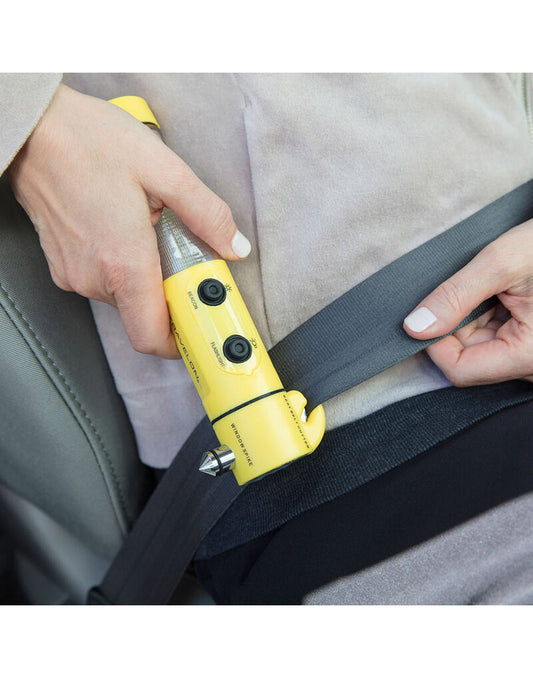 Product Image – Travelon 4-in-1 Emergency Car Tool cutting a seatbelt