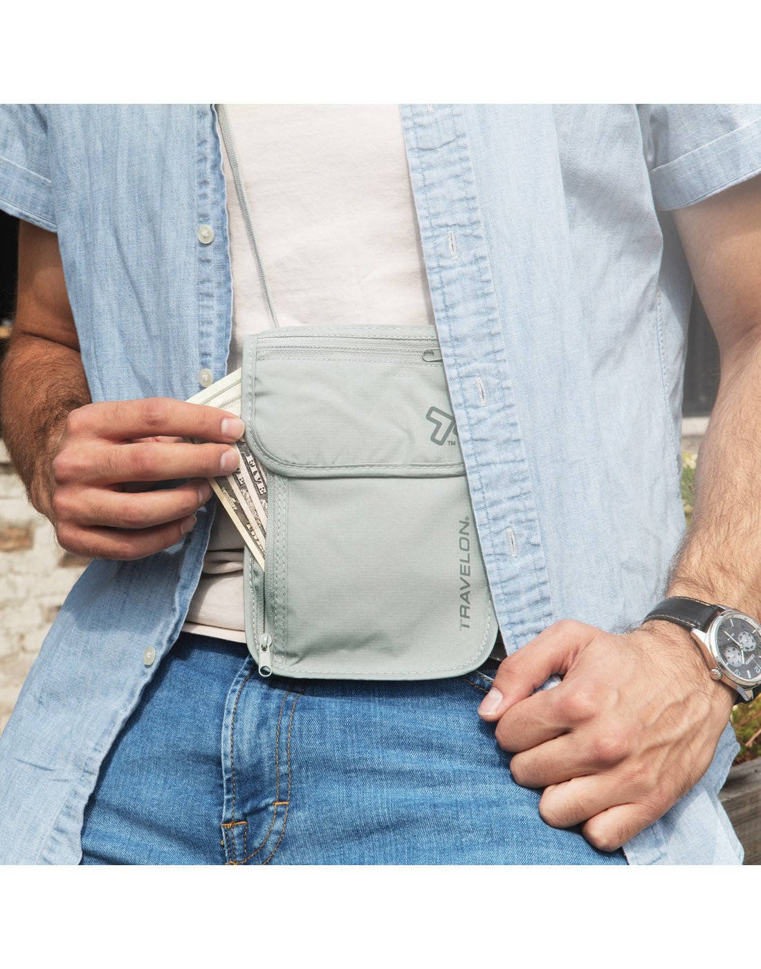 Man wearing Travelon RFID Blocking Undergarment Neck Pouch, zipper pocket is unzipped with cash partially visible.