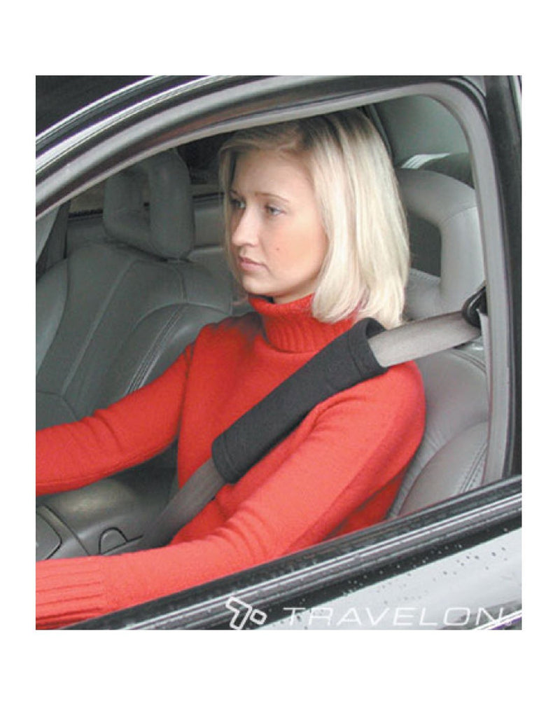 Girl using travelon seat belt shoulder pad tan colour product view