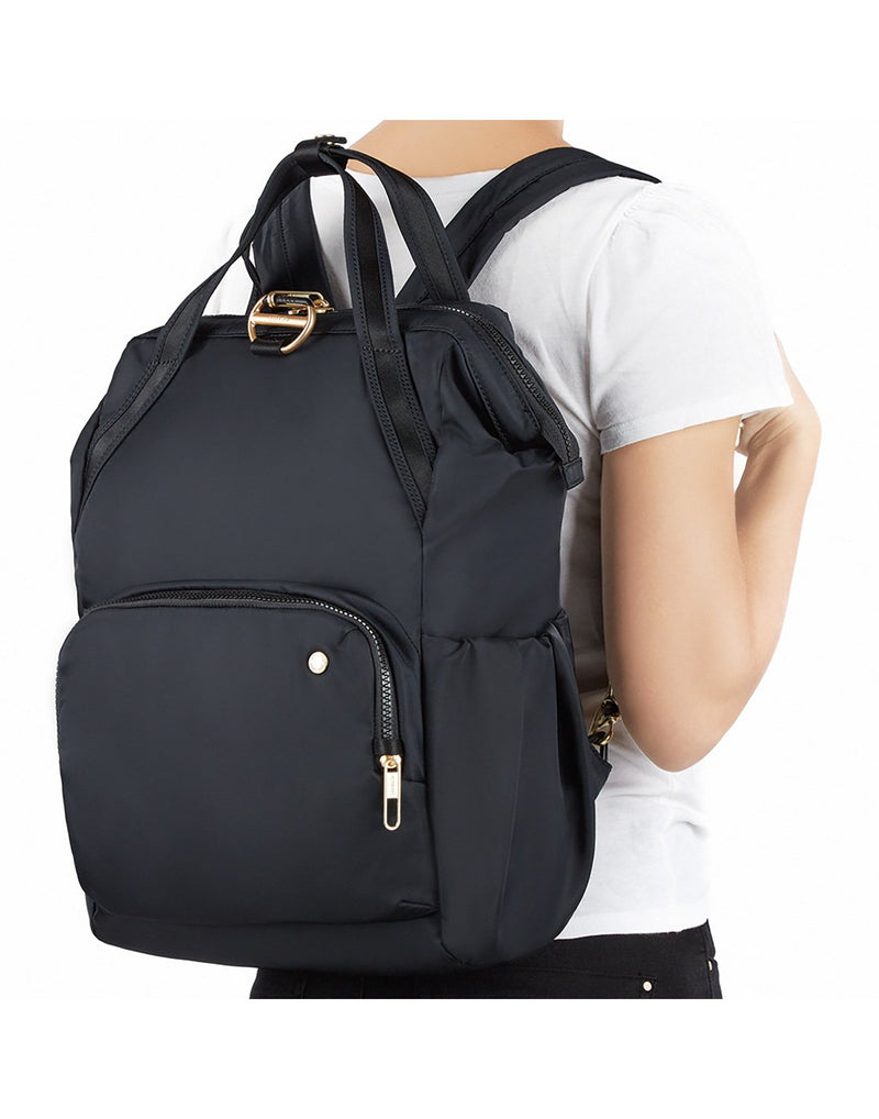Women wearing pacsafe citysafe cx anti-theft 17L backpack front view