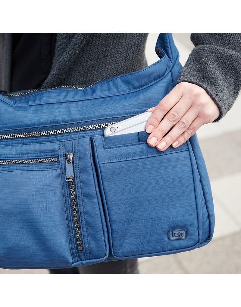 Women carrying lug double dutch 2 crossbody bag blue colour handbag mobile pocket view