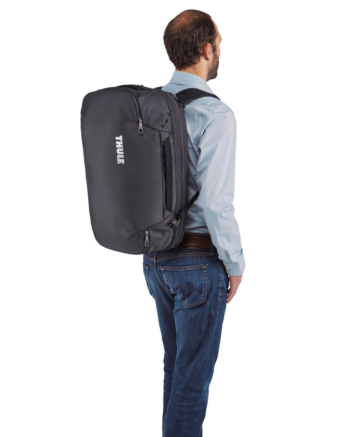 Men using thule subterra carry-on 40L dark shadow colour bag using as shoulder bag side view