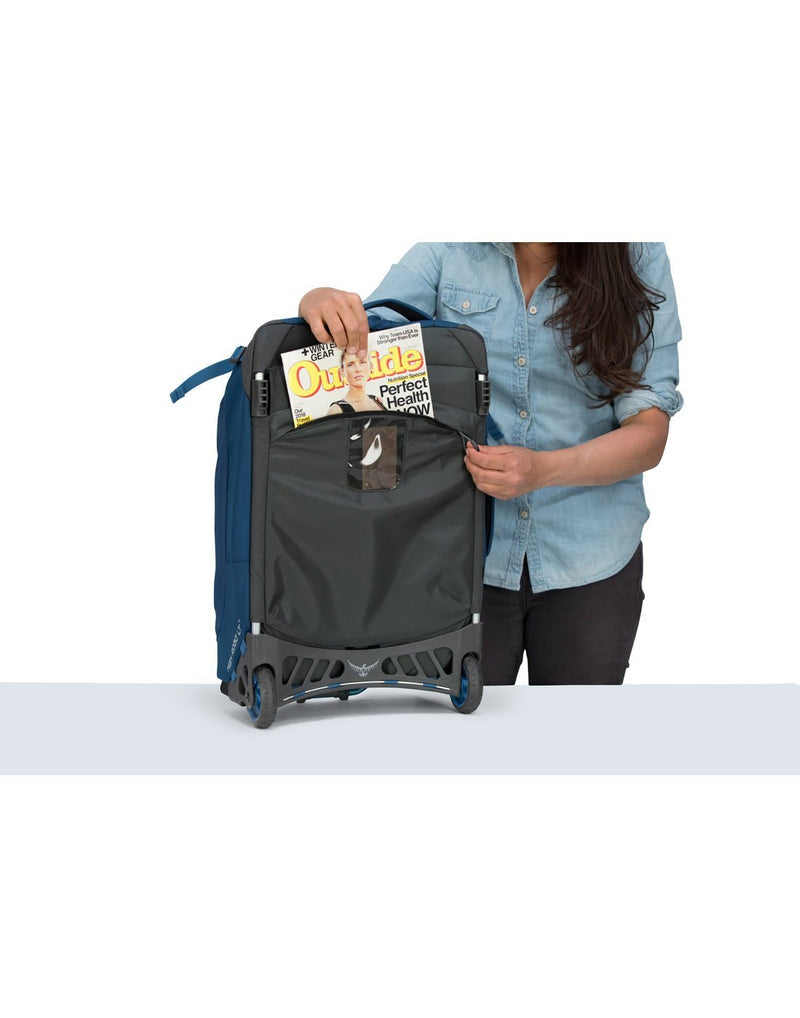 Women carrying osprey ozone 42L/21.5" buoyant blue colour luggage bag external pocket