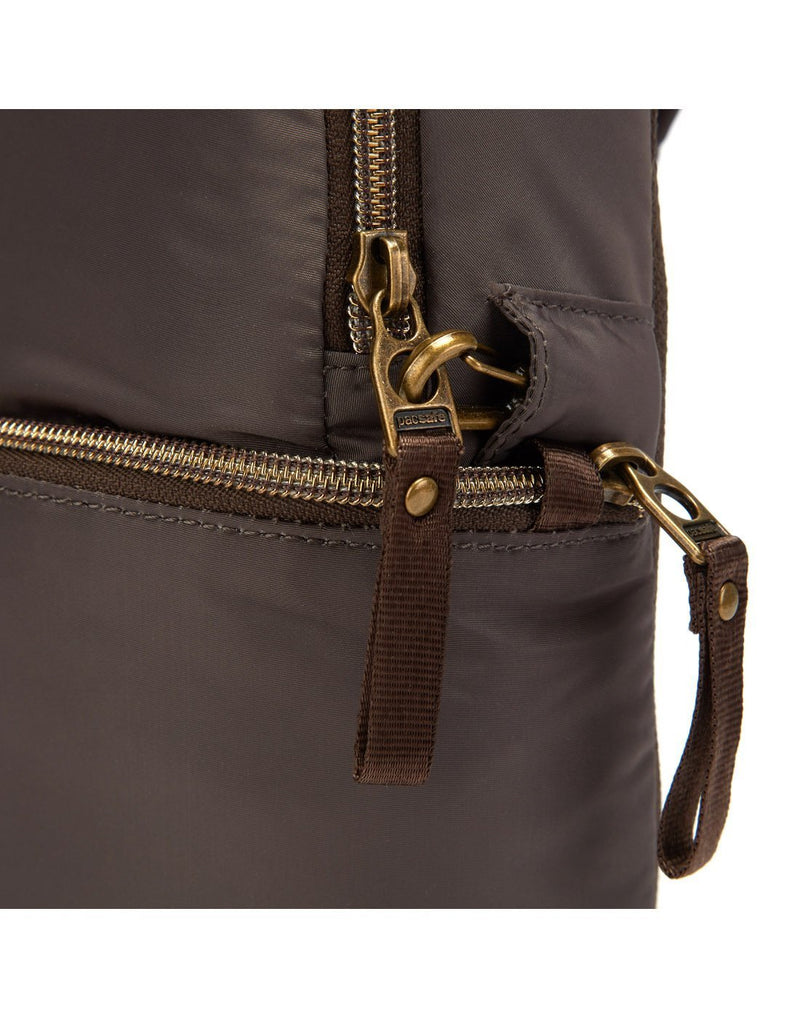 Women wearing pacsafe stylesafe anti-theft mocha colour sling backpack chain holder