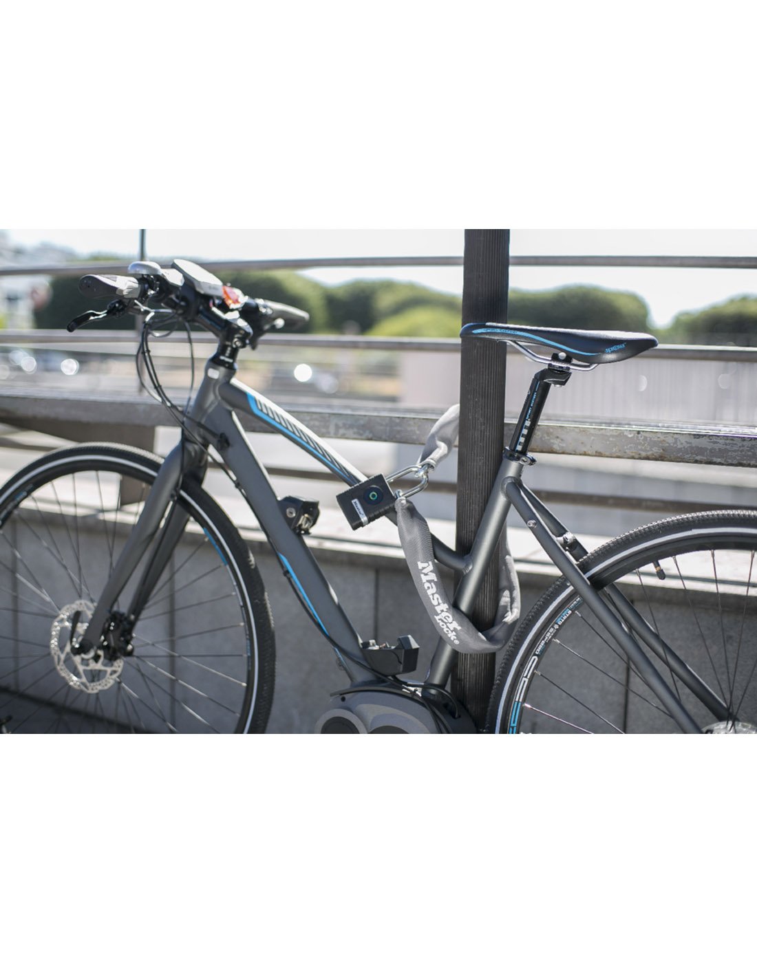 Master Lock® Bluetooth® Padlock locking up a bicycle