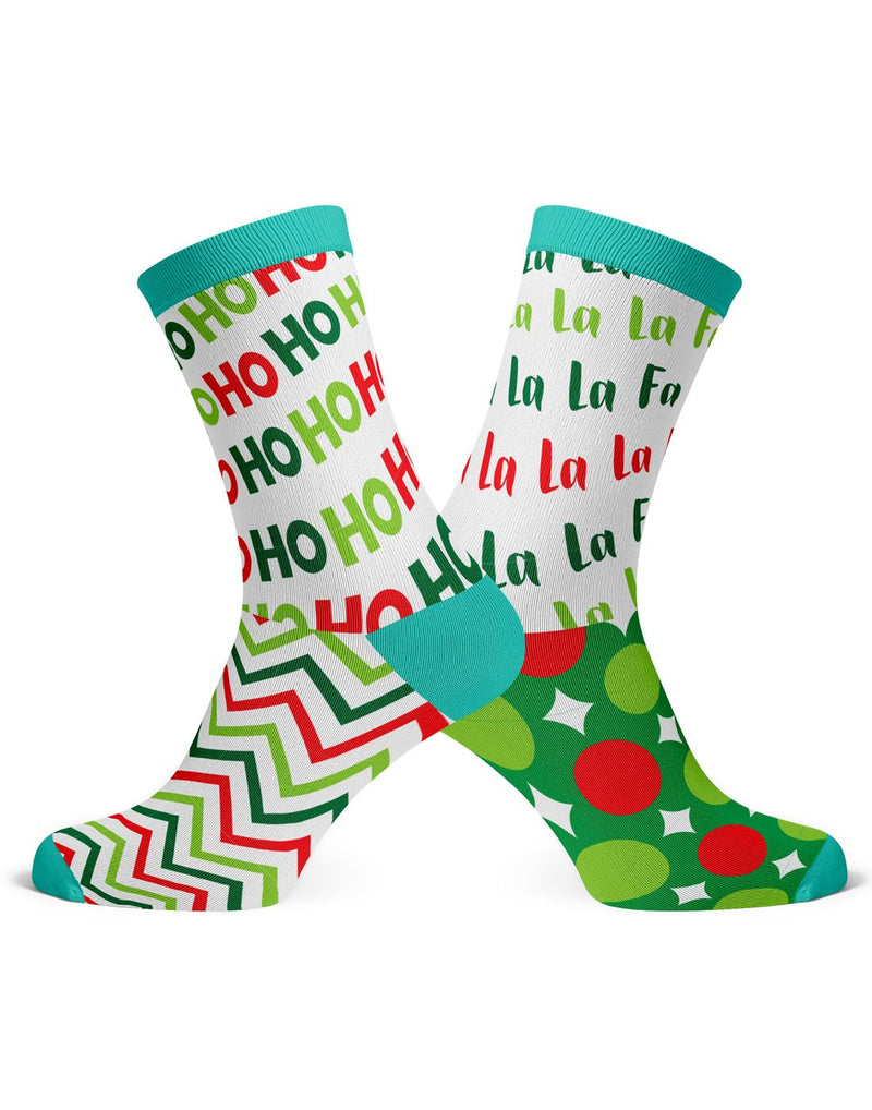 Two different socks, one is white with turquoise toe, heel and cuff with light green, dark green and red zigzag pattern on foot and words Ho Ho Ho in light green, dark green and red on the ankle; the other sock has dark green foot with light green and red circles and white diamonds and white ankle with words Fa La La in light green, dark green and red, with turquoise toe, heel and cuff