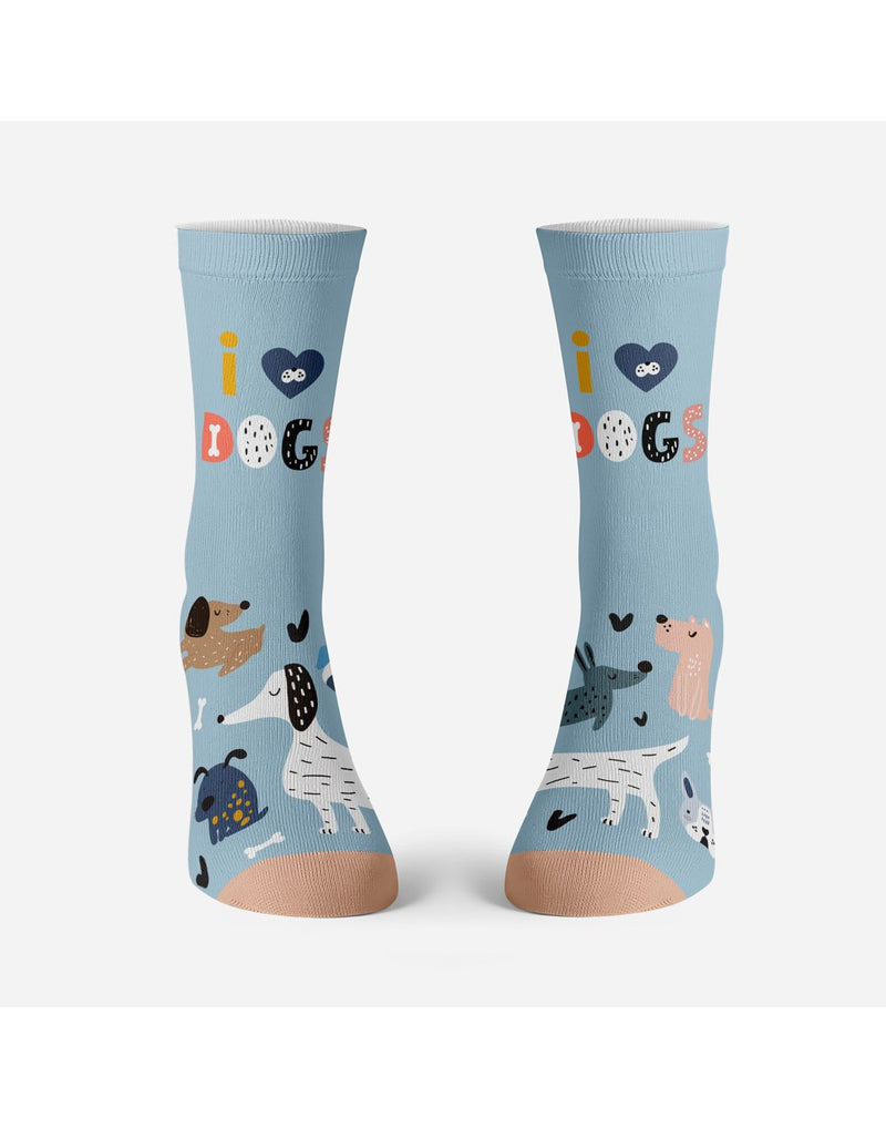 Two light blue socks with peach toe with several dogs on each foot, one white with black ears, one light brown with dark brown ears, one dark blue with yellow spots, one pink with white spots, one dark blue with black spots.  White dog bones and black hearts around the dogs and on the ankle, colourful words i (heart symbol) DOGS