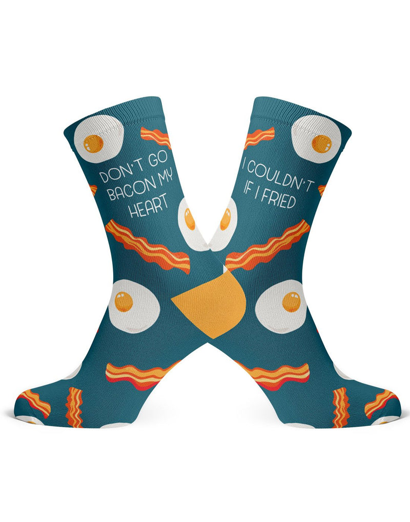 Two dark turquoise socks with yellow heel and bacon strips and fried eggs, one sock reads Don't Go Bacon My Heart in white capital letters and the other sock reads I Couldn't if I Fried in white capital letters