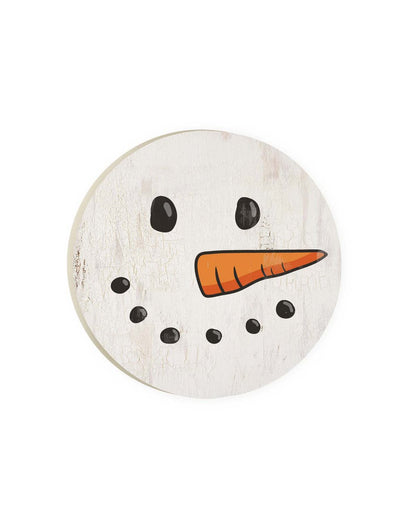 Round car coaster with white crackled paint design with black coal shaped eyes and mouth and orange carrot nose