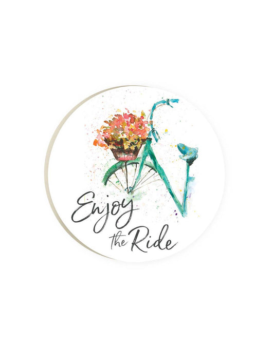 Product Image – Round car coaster with white background and watercolour image of a blue bicycle and basket of pink flowers with words Enjoy the Ride in black brush font