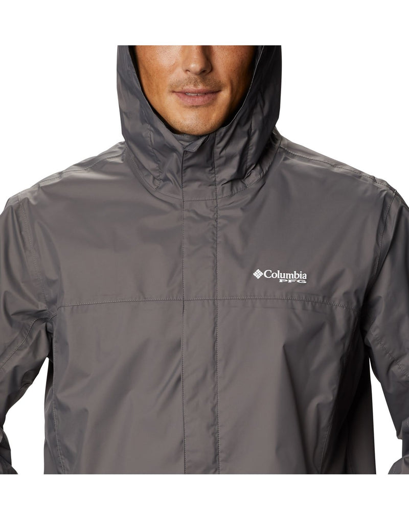 Close up of man wearing Columbia Men's PFG Storm™ Jacket  - city grey, with hood up and white Columbia PFG logo on left breast