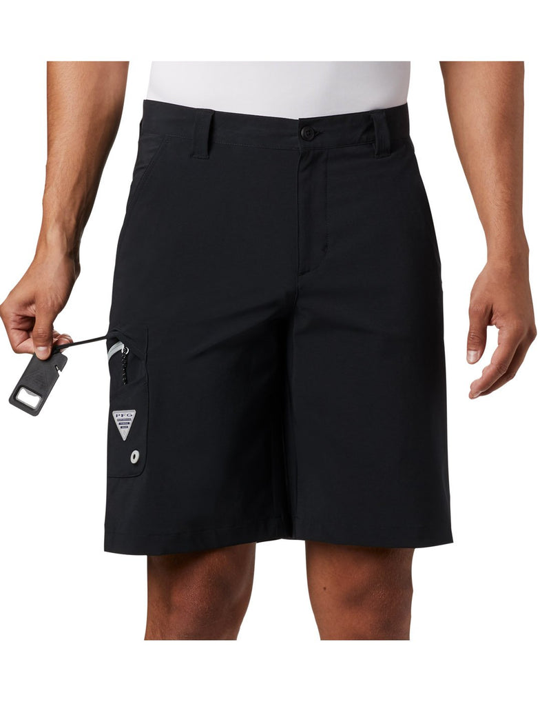 Close up of man wearing Columbia Men's PFG Terminal Tackle™ Short - black, front view, showing attached bottle opener in side pocket